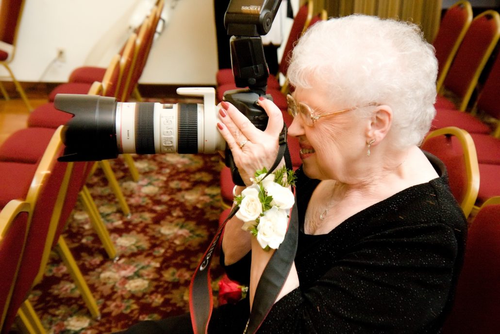 A guest borrows professional photography equipment